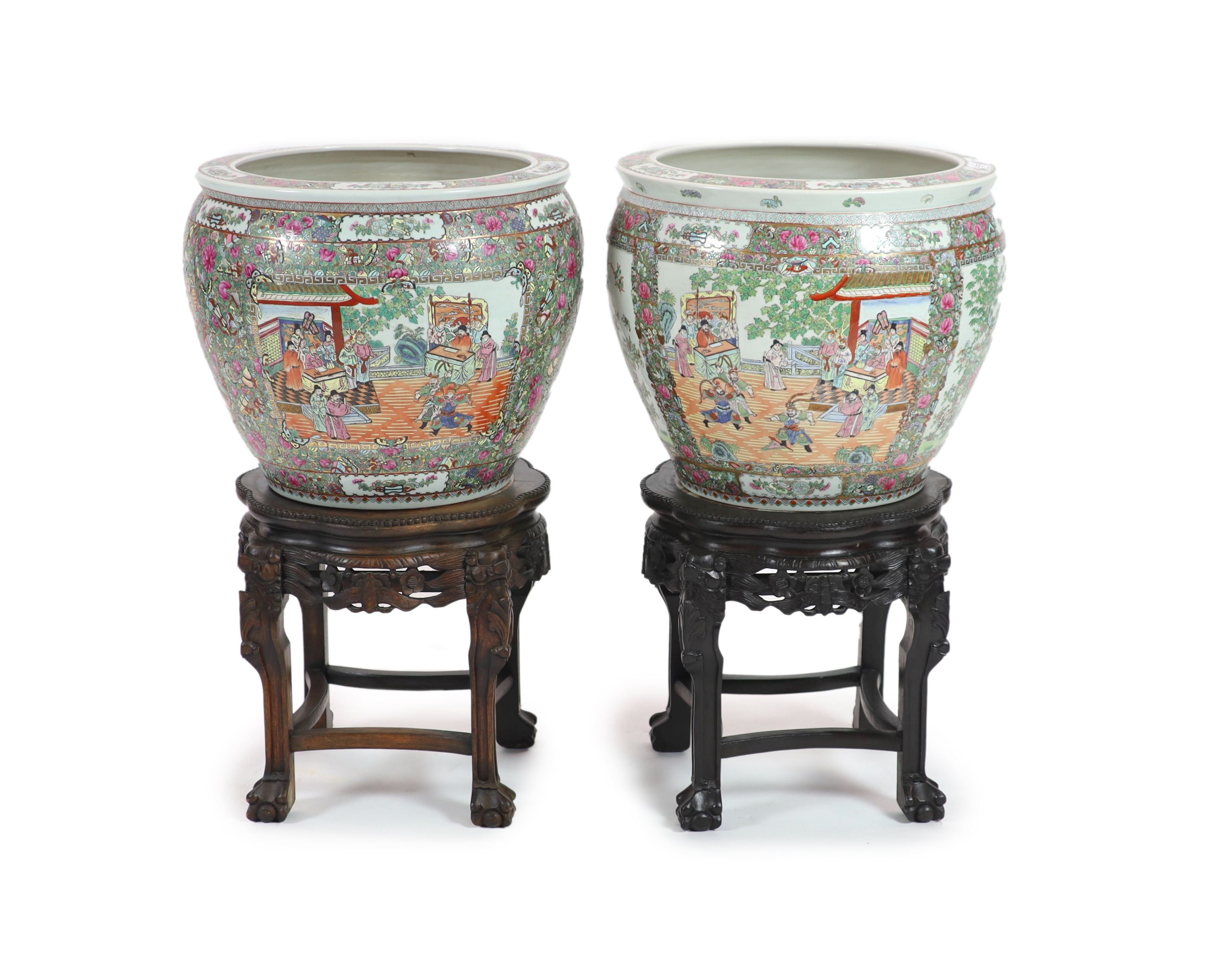 A pair of Chinese famille rose fish bowls on ebonised marble inset stands, diameter 56cm, total height 91cm